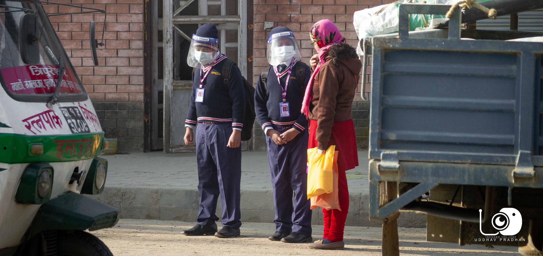 Students wearing masks and waiting for school bus (Nepal)