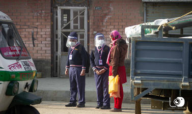 Students wearing masks and waiting for school bus (Nepal)